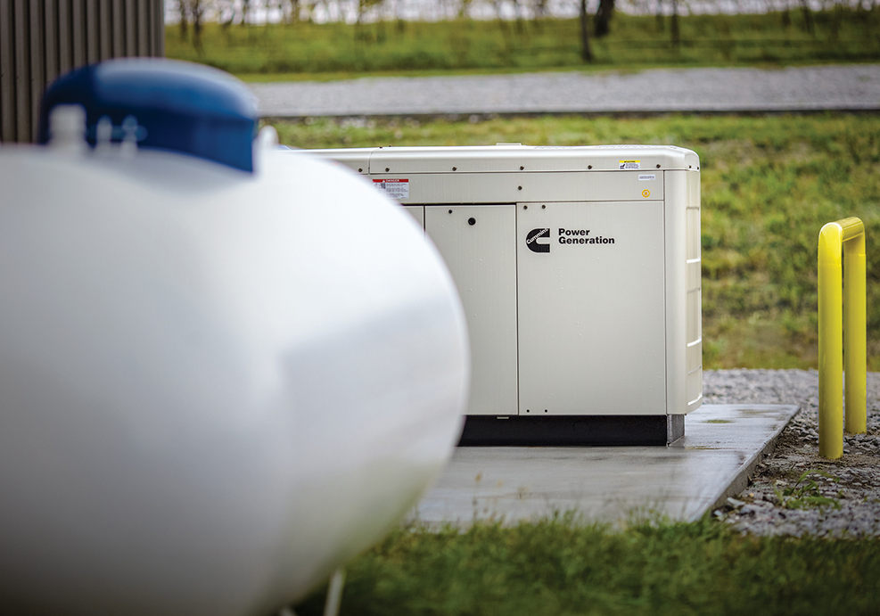 Portable propane generator operating safely outside, far from windows and doors.