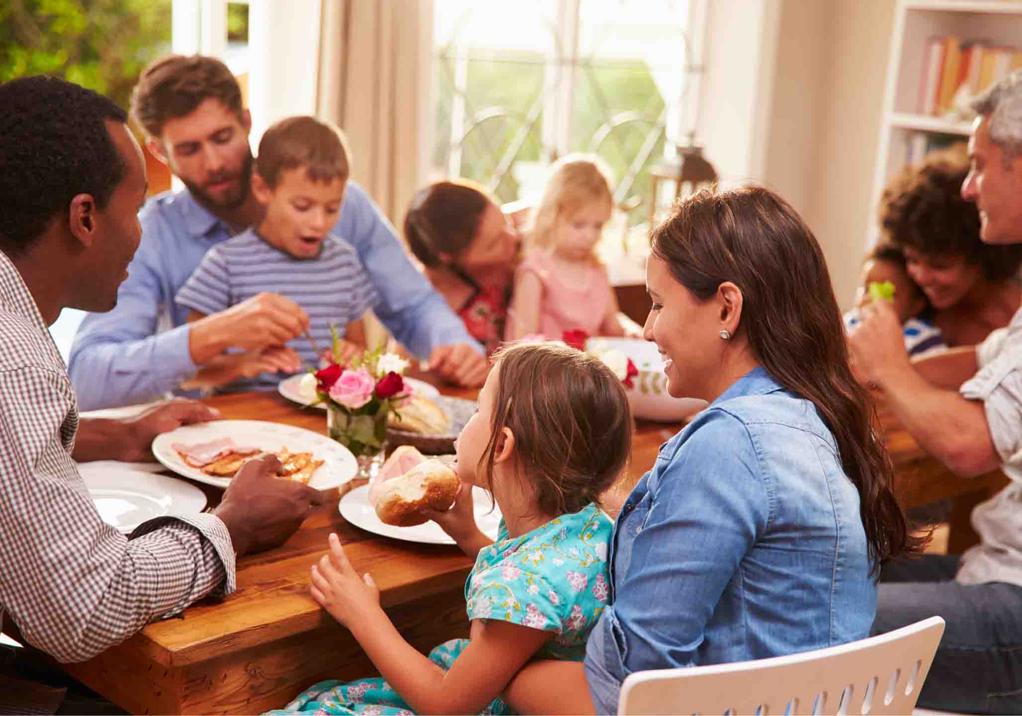 Family get together around dining room table.